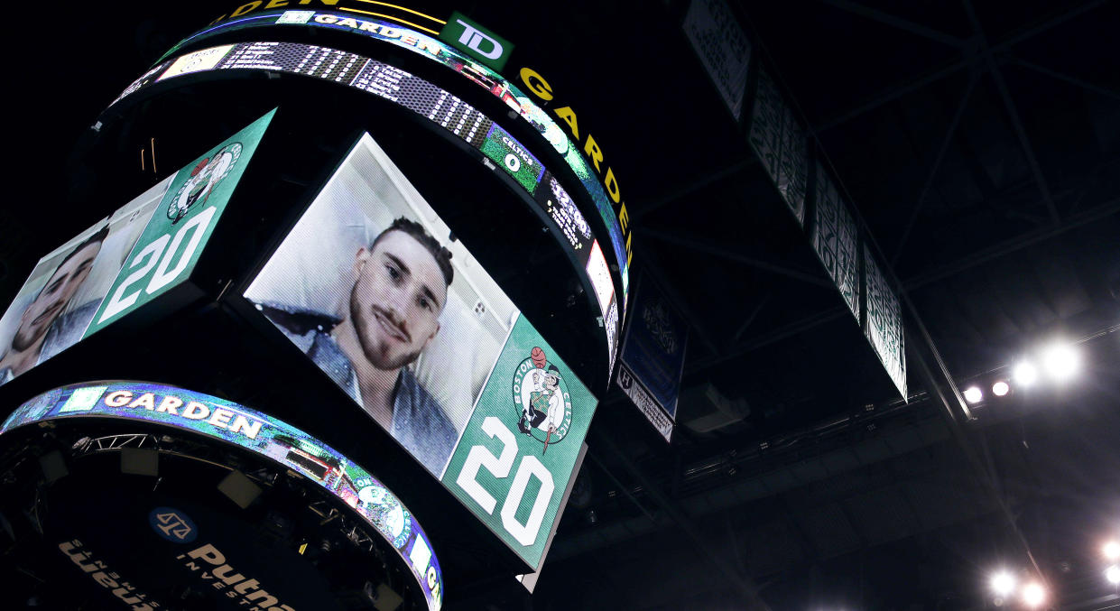 Boston Celtics forward Gordon Hayward speaks to fans at TD Garden in a video message recorded from his hospital bed. (AP Photo/Charles Krupa)