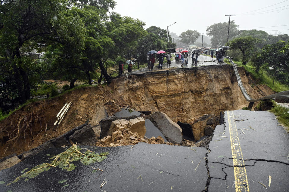 A road connecting the two cities of Blantyre and Lilongwe is seen damaged following heavy rains caused by Tropical Cyclone Freddy in Blantyre, Malawi Tuesday, March 14 2023. The unrelenting cyclone that is currently battering southern Africa has killed at more than 50 people in Malawi and Mozambique since it struck the continent for a second time on Saturday night, authorities in both countries have confirmed. (AP Photo/Thoko Chikondi)