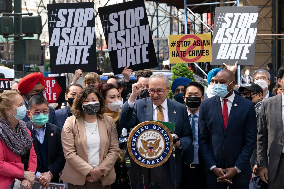 Senate Majority Leader Chuck Schumer, D-N.Y., center, is joined by U.S. Rep. Grace Meng, D-N.Y., third from left, at a news conference to discuss an Asian-American hate crime bill, Monday, April 19, 2021, in New York. Schumer is pushing for passage of the COVID-19 Hate Crimes Act in the Senate. (AP Photo/Mark Lennihan) ORG XMIT: NYML103