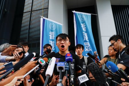 Isaac Cheng, vice-chairperson of Demosisto, a pro-democracy party in Hong Kong, speaks to the members of the media after the arrest of the pro-democracy activist Joshua Wong, in Hong Kong