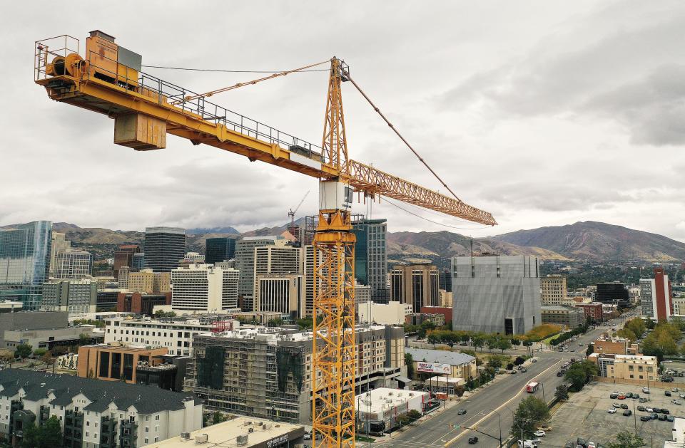 Building construction continues with a crane in downtown Salt Lake City on Tuesday, Oct. 3, 2023. | Jeffrey D. Allred, Deseret News