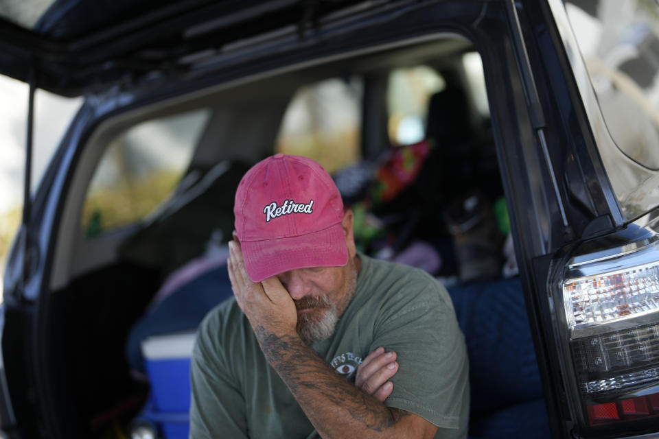 Snowbird William Wellema, who would spend six months a year at his trailer in Red Coconut mobile home park on Estero Island, tears up as he talks about his frustration at not being allowed on to the island to survey what remains of his trailer and recover whatever he can, after Hurricane Ian, in Fort Myers Beach, Fla., Friday, Oct. 7, 2022. Wellema drove from New Jersey after the storm, but arrived to find the access bridge closed to all but emergency personnel. After four days living out of his car, he’s considering crossing by kayak at night. (AP Photo/Rebecca Blackwell)