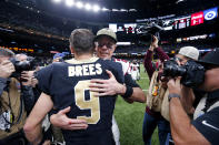 New Orleans Saints quarterback Drew Brees (9) hugs Atlanta Falcons quarterback Matt Ryan after an NFL football game in New Orleans, Sunday, Nov. 10, 2019. The Falcons won 26-9.(AP Photo/Butch Dill)