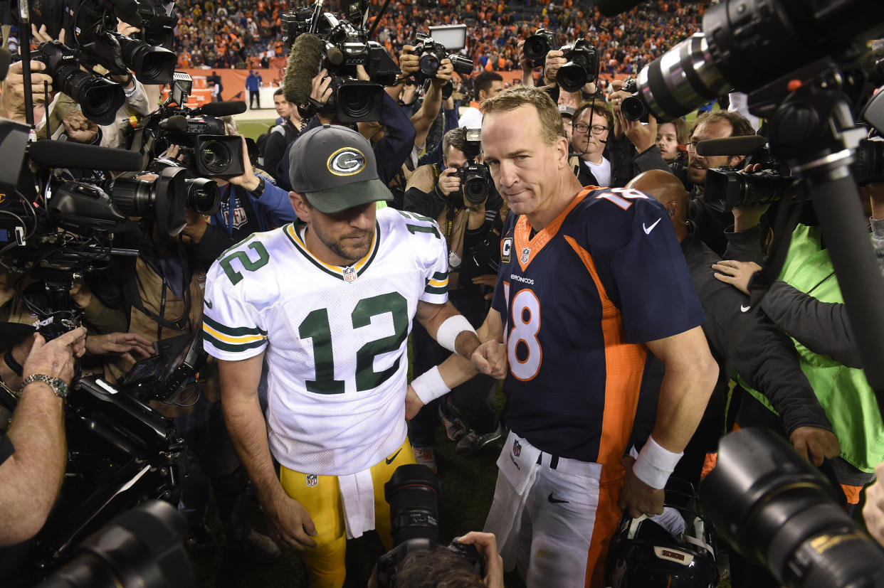 Denver Broncos quarterback Peyton Manning and Green Bay Packers quarterback Aaron Rodgers greet each other following Denver's 29-10 win on Sunday, Nov. 1, 2015, at Sports Authority Field at Mile High Stadium in Denver. (Mark Reis/Colorado Springs Gazette/Tribune News Service via Getty Images)