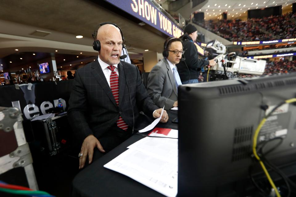 New Jersey Devils announcers Ken Daneyko, left, and Steve Cangialosi work during third period of an NHL game between the Devils and the Philadelphia Flyers, Tuesday, April 4, 2017, in Newark, N.J. (AP Photo/Julio Cortez)