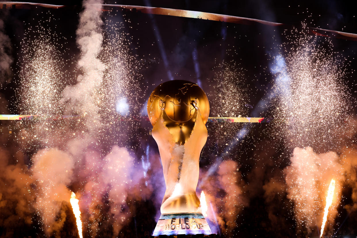 LUSAIL CITY, QATAR - DECEMBER 13: A replica World cup trophy is seen during the pre-match entertainment ahead of the FIFA World Cup Qatar 2022 semi final match between Argentina and Croatia at Lusail Stadium on December 13, 2022 in Lusail City, Qatar. (Photo by Alex Livesey - Danehouse/Getty Images)