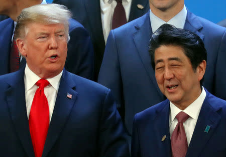 FILE PHOTO: U.S. President Donald Trump and Japanese Prime Minister Shinzo Abe are seen before a family photo during the G20 summit in Buenos Aires, Argentina November 30, 2018. REUTERS/Marcos Brindicci/File Photo