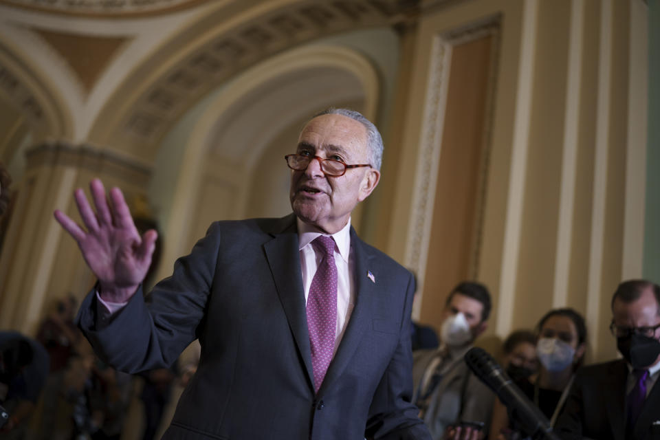 In this Sept. 28, 2021, file phot, Senate Majority Leader Chuck Schumer, D-N.Y., speaks to reporters after a Democratic policy meeting at the Capitol in Washington. Congress is moving to avert one crisis while putting off another. The Senate is poised to approve legislation Thursday that would keep the federal government running into early December. (AP Photo/J. Scott Applewhite)