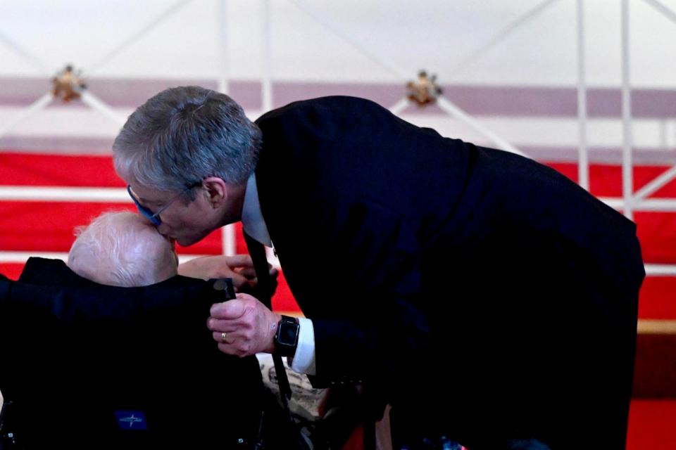 PHOTO: James 'Chip' Carter kisses the head of his father, former U.S. President Jimmy Carter, during a tribute service for former U..S First Lady Rosalynn Carter, at Glenn Memorial Church, Nov. 28, 2023, in Atlanta. (Andrew Caballero-Reynolds/AFP via Getty Images)