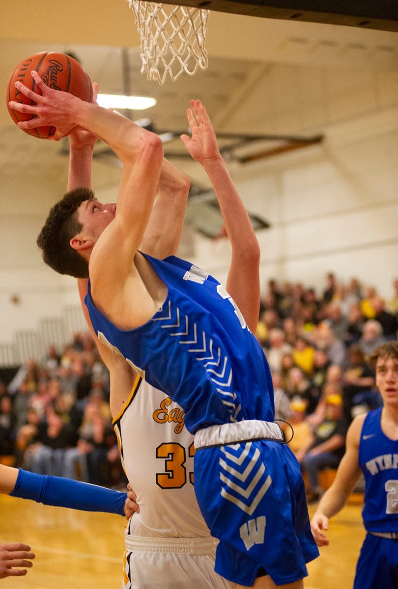 Wynford's Sam McMillan grabs a rebound for a putback.