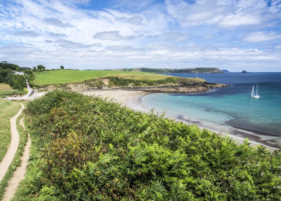 <p>There's no need to pack some soggy sandwiches and a flask of lukewarm tea when you visit Porthcurnick because one of Cornwall's foodie gems is situated just metres from the shore.</p><p><a href="https://www.hiddenhut.co.uk/" rel="nofollow noopener" target="_blank" data-ylk="slk:The Hidden Hut;elm:context_link;itc:0;sec:content-canvas" class="link ">The Hidden Hut</a> attracts locals and holidaymakers alike with its daily changing menu of delicious soups and stews, fresh salads and seafood and, of course, hot Cornish pasties.</p>