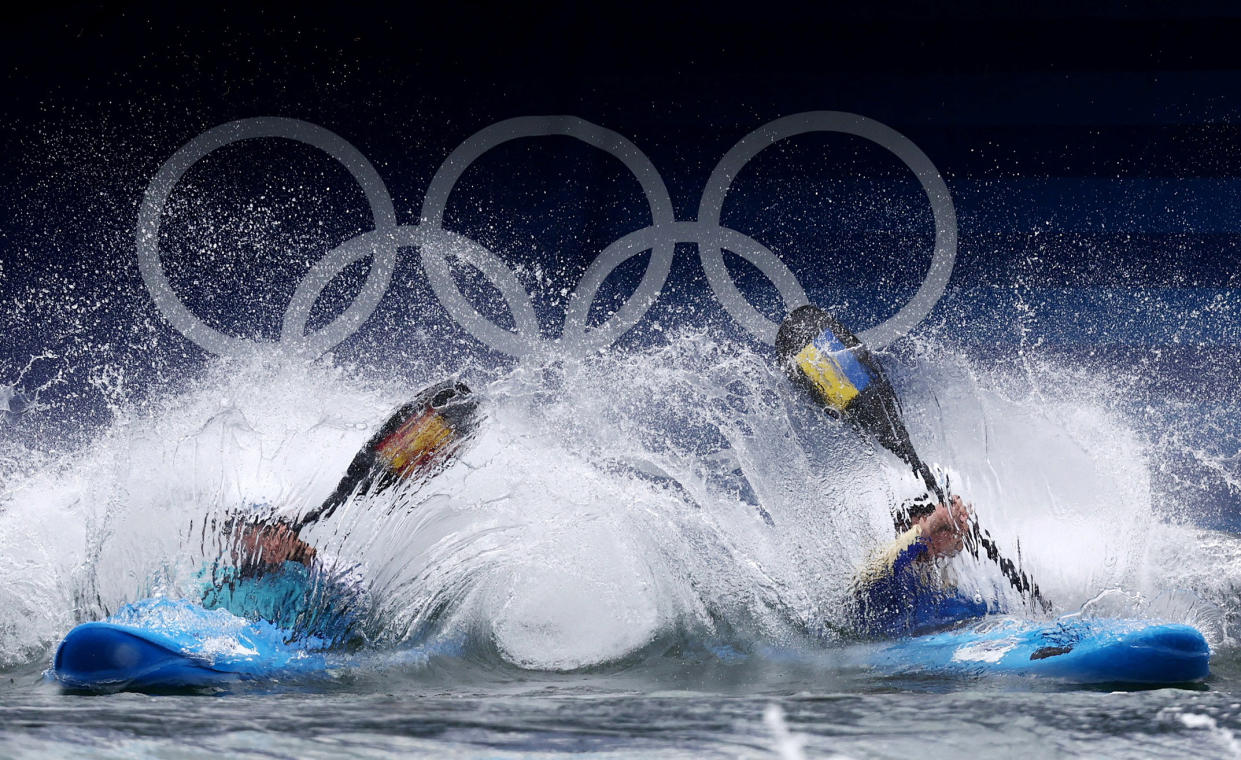 Maialen Chourraut of Spain and Viktoriia Us of Ukraine compete in the women's kayak cross round one on Saturday.