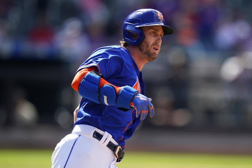 New York Mets' Jeff McNeil watches the ball he hit for an RBI double as he runs to second base during the third inning in the first baseball game of a doubleheader against the St. Louis Cardinals Tuesday, May 17, 2022, in New York. (AP Photo/Frank Franklin II)