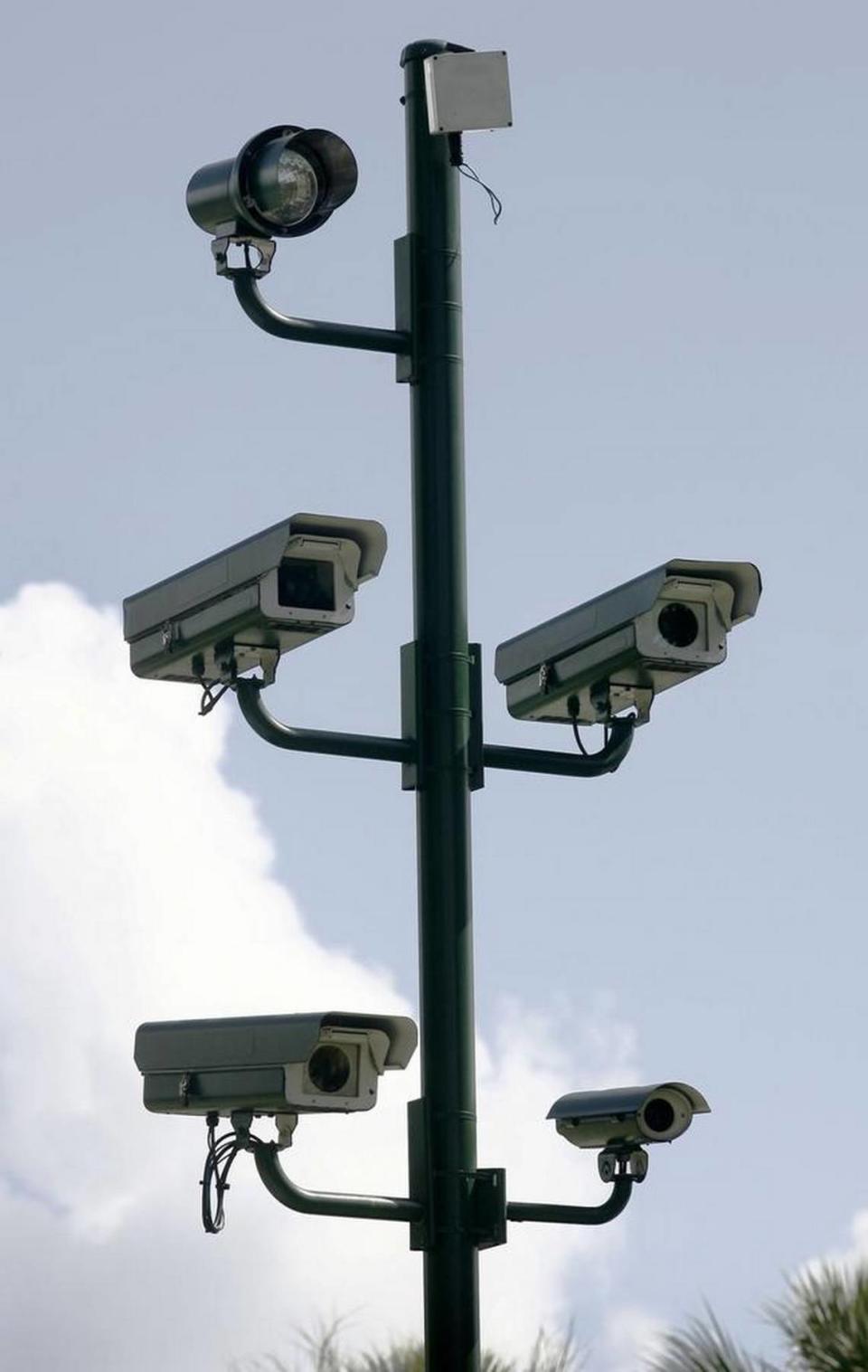 Traffic cameras watch the intersection of West Country Club Drive and Aventura Boulevard, Aug. 21, 2009.