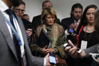 Sen. Lisa Murkowski, R-Alaska, declines to answer questions from reporters as she walks, Wednesday, Jan. 22, 2020, on Capitol Hill in Washington. The U.S. Senate has begun hearing opening arguments in President Donald Trump’s impeachment trial with proceedings now on a fast track. (AP Photo/ Jacquelyn Martin)