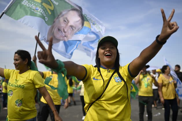 Brazil's famous yellow soccer shirt has taken on renewed political significance over the last decade, especially under President Jair Bolsonaro, whose backers often wear the shirt to show their support for the right-wing leader. (Photo: Mateus Bonomi/Anadolu Agency via Getty Images)