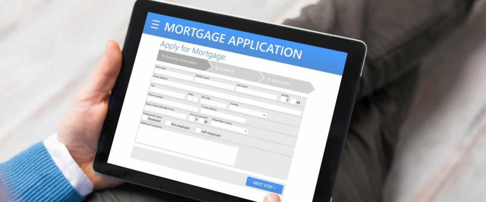Man filling mortgage application online