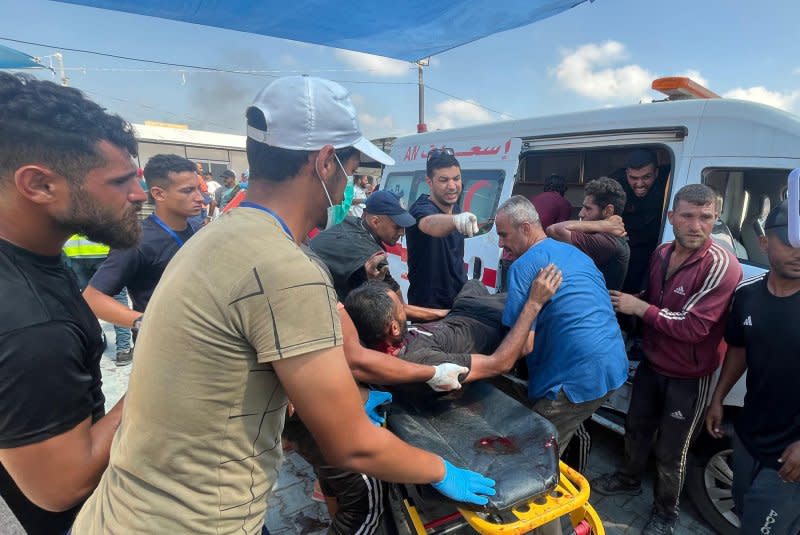 Wounded Palestinians are brought to the Kuwaiti field hospital after Israel attacked two Hamas leaders in al-Mawasi near Khan Younis early Saturday. Photo: Saber Arar/UPI