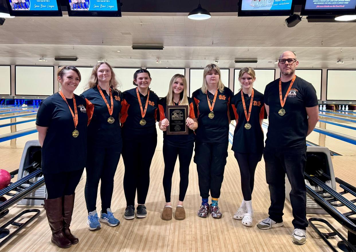 The Marlboro girls bowling team poses with its Section 9 championship banner on Feb. 12, 2024. From left: coach Michele Landis, Paige Brooks, Paige Brooks, Chloe Decker, Emily Tarsio, Olivia Cherubini, Stevie Amato and coach John Morrissey.