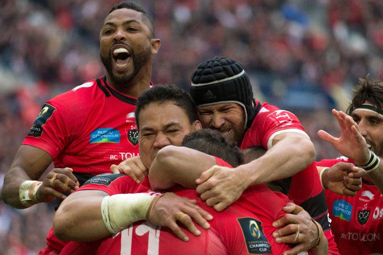 Toulon's winger Bryan Habana (down) is congratulated by teammates after scoring a try during the European Champions Cup rugby union semi final match between Toulon and Leinster on April 19, 2015 in Marseille