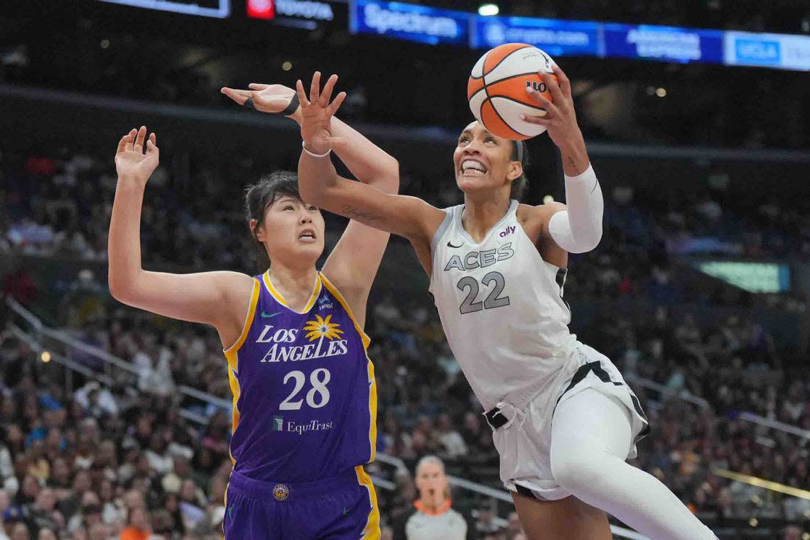 Jul 5, 2024; Los Angeles, California, USA; Las Vegas Aces center A’ja Wilson (22) shoots the ball against LA Sparks center Li Yueru (28) in the second half at Crypto.com Arena.