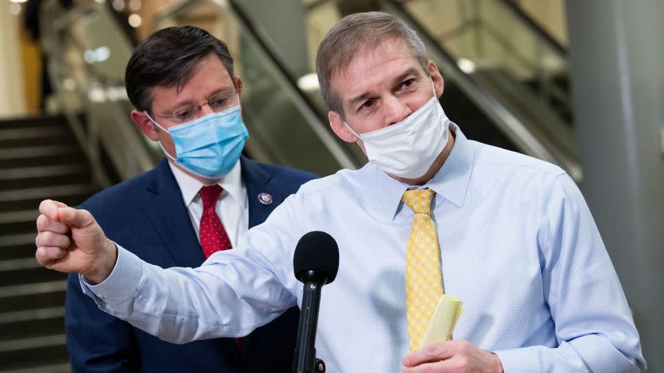 Reps. Jim Jordan, right, and Mike Johnson speak with reporters in the Senate subway after the first day of the impeachment trial of former President Donald Trump in the Capitol in Washington, DC, on February 9, 2021. - Tom Williams/CQ-Roll Call/Getty Images