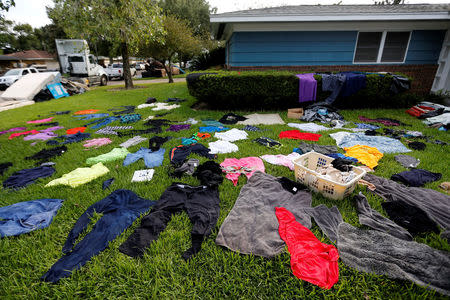 Clothes are seen laid out to dry in the aftermath of Tropical Storm Harvey in Port Arthur, Texas, U.S. September 5, 2017. REUTERS/Jonathan Bachman