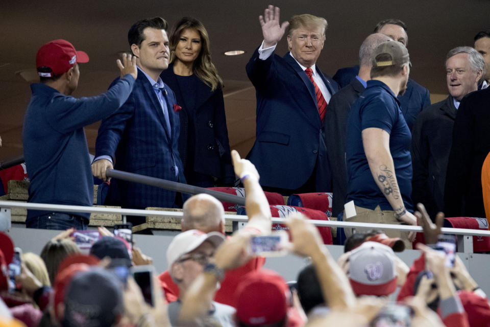 President Donald Trump and first lady Melania Trump, third from left, arrive for Game 5 of the World Series baseball game between the Houston Astros and the Washington Nationals at Nationals Park in Washington, Sunday, Oct. 27, 2019. Also pictured are Rep. Matt Gaetz, R-Fla., second from left, and Rep. Mark Meadows, R-N.C, right. (AP Photo/Andrew Harnik)