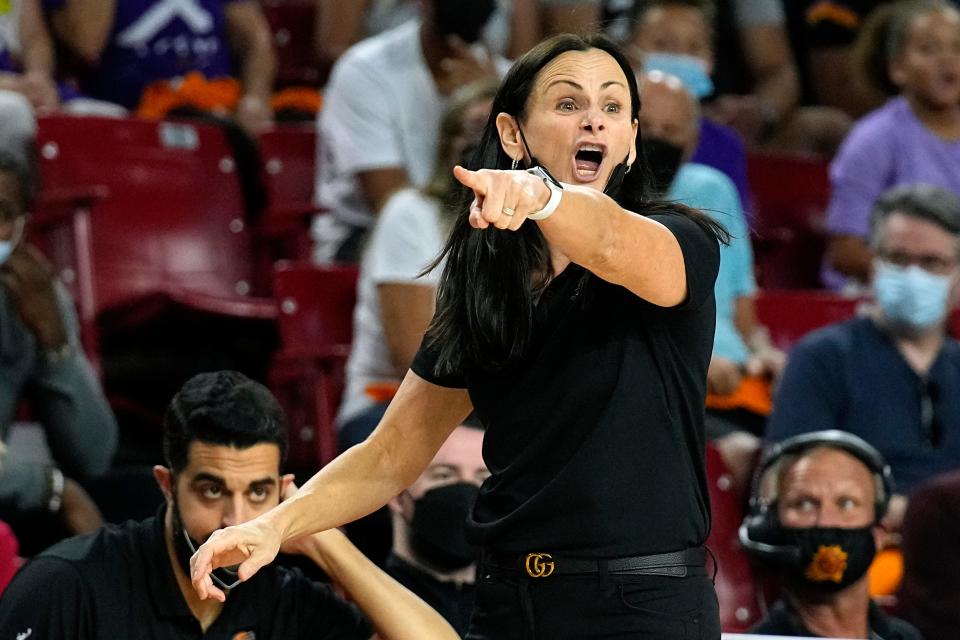 FILE - Phoenix Mercury head coach Sandy Brondello gestures during the first half of a WNBA basketball game against the Las Vegas Aces, Sunday, Oct. 3, 2021, in Phoenix. The New York Liberty hired Sandy Brondello to be their new coach Friday, Jan. 7, 2022. (AP Photo/Rick Scuteri, File)