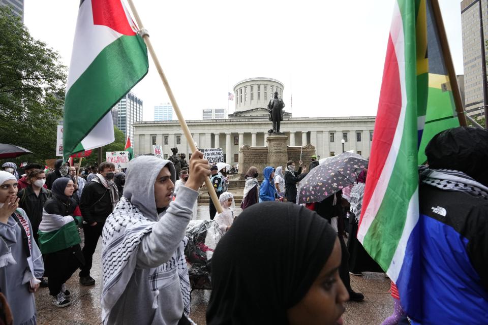 On the 76th anniversary of the Nakba, the displacement of Palestinian refugees from their homes in Israel, Palestinian Diaspora Movement, Students for Justice in Palestine (SJP) at Ohio State University, Pal Awda and SJP at the University of Cincinnati held a protest Wednesday afternoon at the Ohio Statehouse. Afterwards, most of the estimated 300 protesters marched along North High Street to Buttles Avenue, then to Goodale Park and along Park Avenue and West Swan Street back to North High before heavy rain broke it up.