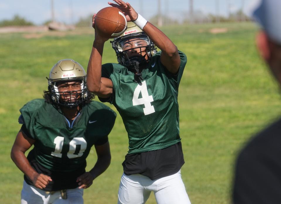 Dash Blake (4) practices with his teammates at Basha High School in Chandler on Aug. 14, 2023.
