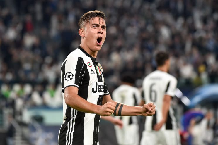 Paulo Dybala celebrates his opening goal against Barcelona (Getty)