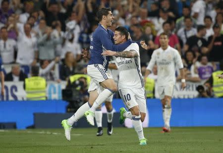 Football Soccer - Real Madrid v FC Barcelona - Spanish Liga Santander - Santiago Bernabeu, Madrid, Spain - 23/4/17 Real Madrid's James Rodriguez celebrates scoring their second goal with team mates Reuters / Susana Vera Livepic