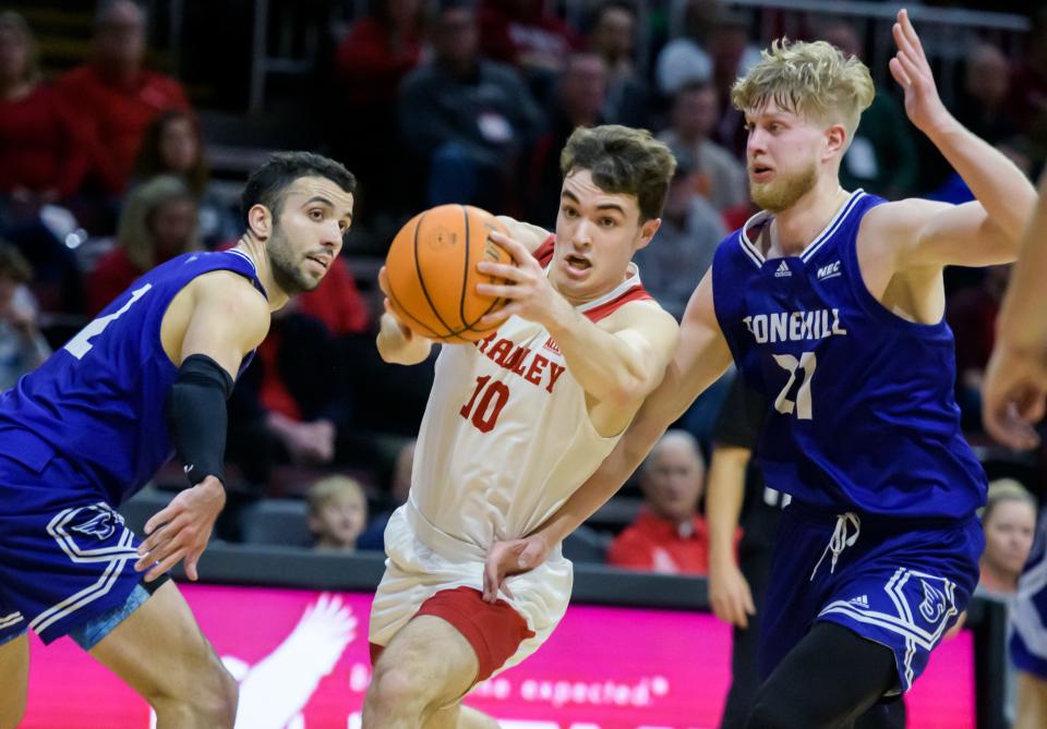 Bradley's Connor Hickman (10) moves to the basket between Stonehill's Will Rywold, left, and Cole Bergan in the first half Monday, Dec. 19, 2022 at Carver Arena. The Braves decimated the Skyhawks 79-50.