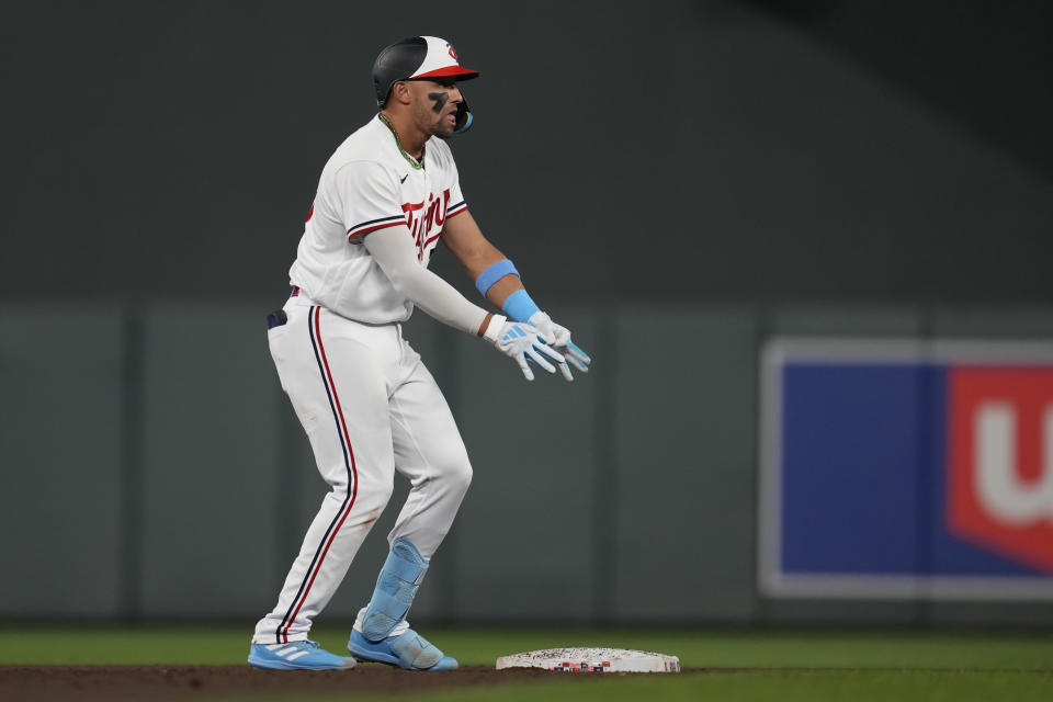 Minnesota Twins' Royce Lewis celebrates his RBI double against the New York Mets during the seventh inning of a baseball game Friday, Sept. 8, 2023, in Minneapolis. (AP Photo/Abbie Parr)