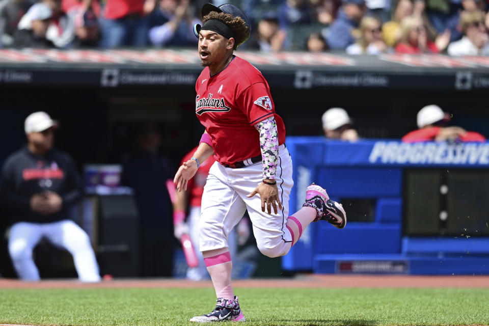 Cleveland Guardians first baseman Josh Naylor scores a run on a fielding error by Los Angeles Angels shortstop Zach Neto during the second inning of a baseball game, Sunday, May 14, 2023, in Cleveland. Will Brennan was out at second base on a fielders choice. (AP Photo/David Dermer)