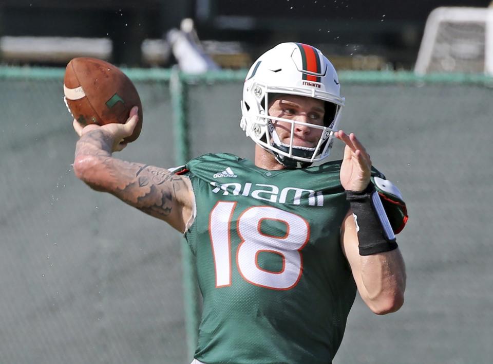 Miami quarterback Tate Martell (18) throws the ball during NCAA college football practice in Coral Gables, Fla., Wednesday, Aug. 7, 2019. (Charles Trainor Jr./Miami Herald via AP)