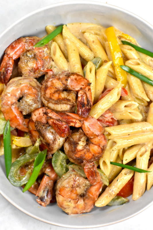 <p>Gypsyplate</p><p>A creamy jerk pasta loaded with red, green and yellow peppers. You can top it off with either shrimp or chicken, or both.</p><p><strong>Get the recipe: <a href="https://gypsyplate.com/rasta-pasta/" rel="nofollow noopener" target="_blank" data-ylk="slk:Rasta Pasta;elm:context_link;itc:0;sec:content-canvas" class="link rapid-noclick-resp">Rasta Pasta</a></strong></p>