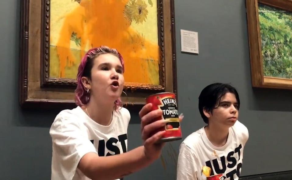 Two young protesters were arrested after throwing soup on the glass covering Vincent Van Gogh’s ‘Sunflowers’ at the National Gallery in London. <a href="https://www.gettyimages.com/detail/news-photo/climate-protesters-hold-a-demonstration-as-they-throw-cans-news-photo/1243970418" rel="nofollow noopener" target="_blank" data-ylk="slk:Just Stop Oil/Handout/Anadolu Agency via Getty Images;elm:context_link;itc:0;sec:content-canvas" class="link ">Just Stop Oil/Handout/Anadolu Agency via Getty Images</a>