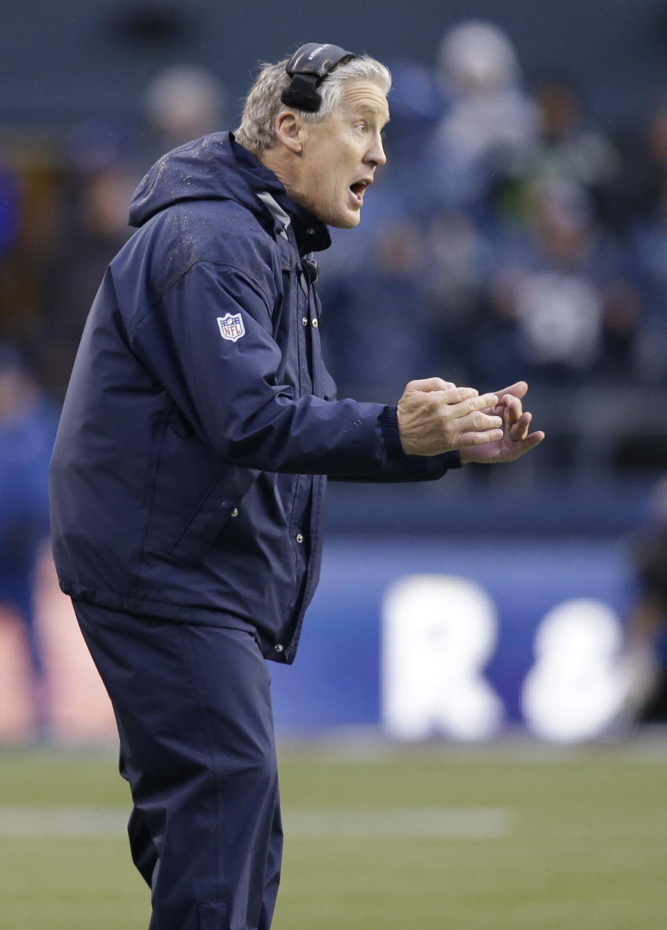 Seattle Seahawks coach Pete Carroll yells on the sideline during the second half of the Seahawks' NFC divisional playoff NFL football game against the New Orleans Saints in Seattle, Saturday, Jan. 11, 2014. (AP Photo/Elaine Thompson)