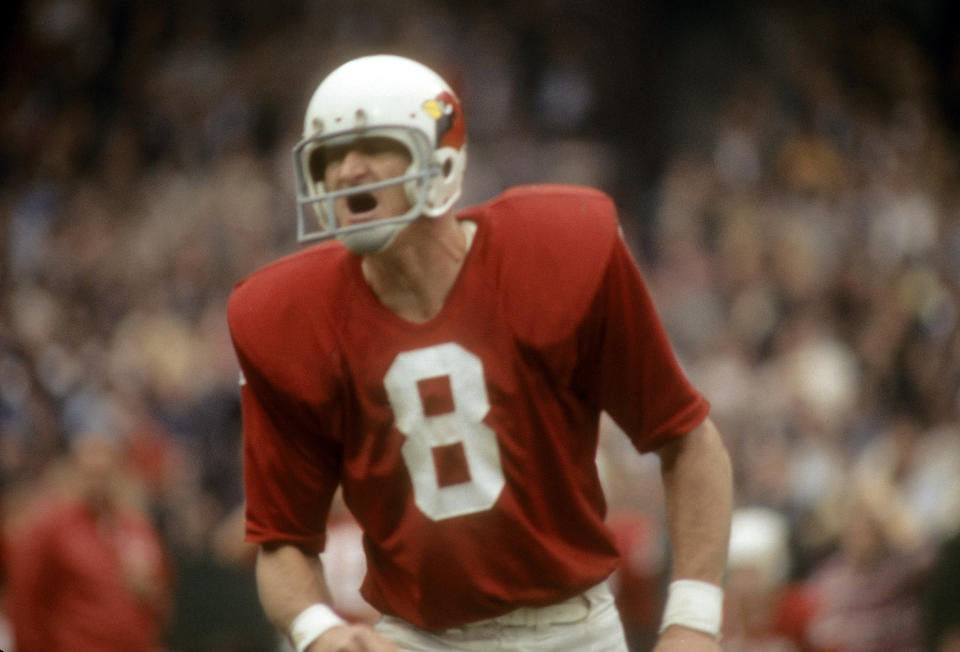 Larry Wilson in an old all-red with white letter No. 8 jersey.