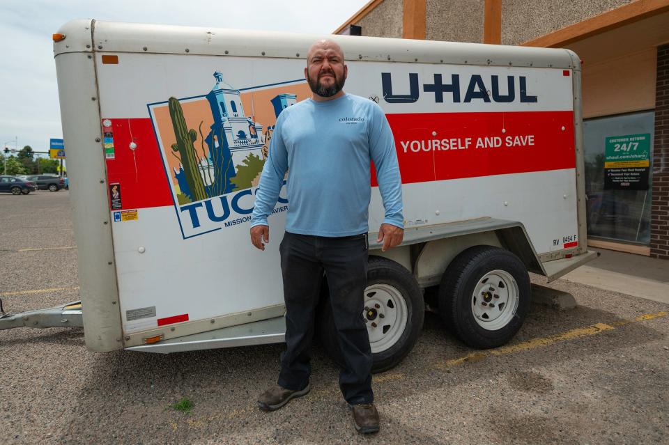 Guud Hands LLC owner Luis Munoz stands in front of a U-Haul trailer outside his business at 1035 S. Pueblo Blvd. The U-Haul dealership was added May 18.