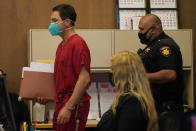 Scott Peterson, left, walks to his seat at the San Mateo County Superior Court in Redwood City, Calif., Thursday, Aug. 11, 2022. Peterson is in court for a hearing to determine whether he gets a new trial in the murder of his pregnant wife because of juror misconduct. (AP Photo/Jeff Chiu, Pool)