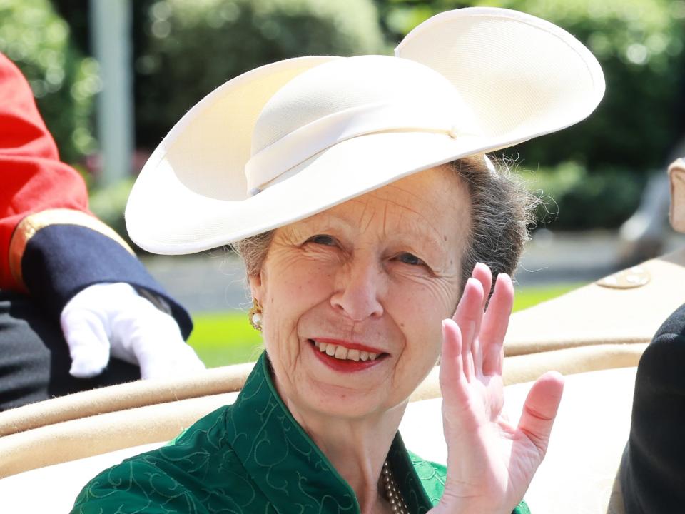 Princess Anne attends day three of Royal Ascot wearing a white hat and green dress