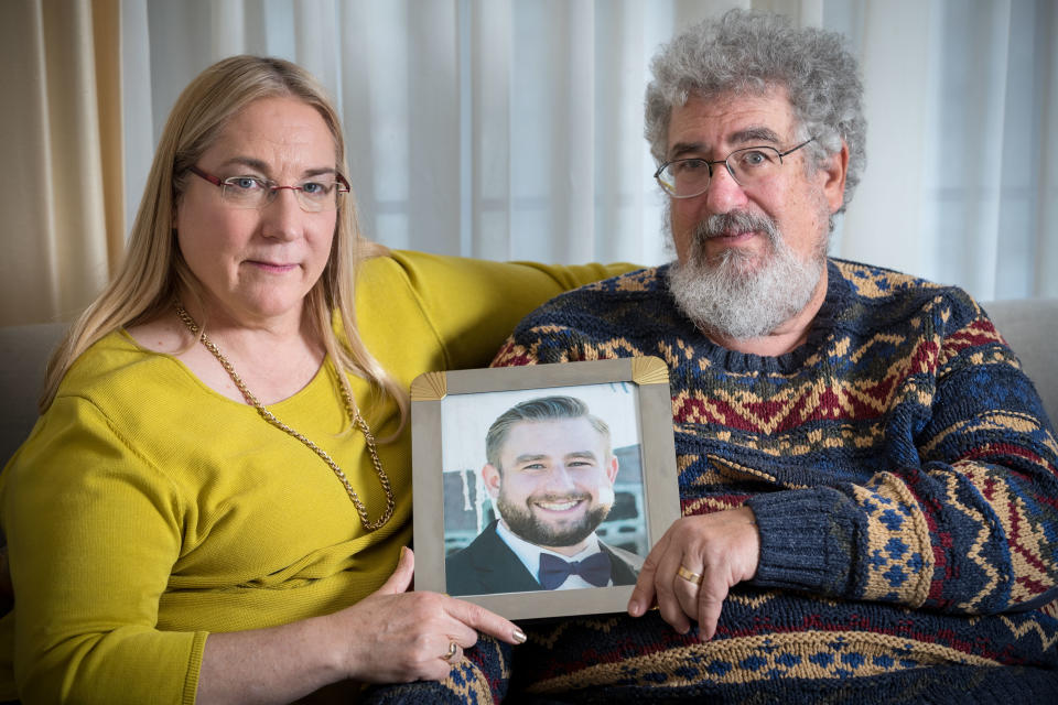 Mary Rich and her husband, Joel Rich hold a photo of their son, Seth Rich in their home in Omaha, Nebraska in 2017.  (Photo: Matt Miller for The Washington Post via Getty Images)