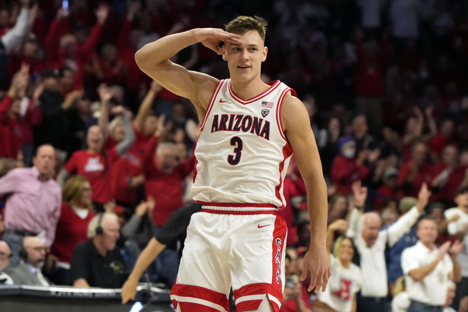 Arizona guard Pelle Larsson salutes the bench after scoring against Oregon during the first half of an NCAA college basketball game, Thursday, Feb. 2, 2023, in Tucson, Ariz. (AP Photo/Rick Scuteri)