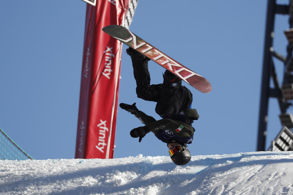 A snowboarder practices for the Big Air Atlanta snowboard and ski competition at SunTrust Park Thursday, Dec. 19, 2019, in Atlanta. (AP Photo/John Bazemore)