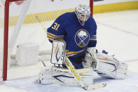 Buffalo Sabres goaltender Dustin Tokarski (31) makes a save during the third period of an NHL hockey game against the Montreal Canadiens on Friday, Nov. 26, 2021, in Buffalo, N.Y. (AP Photo/Joshua Bessex)