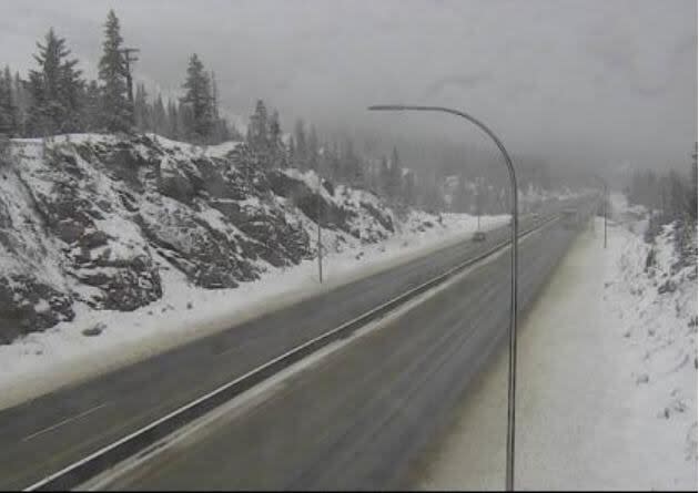 A webcam 61 km north of Merritt, B.C., shows a snowy Saturday afternoon on the Coquihalla Highway (Highway 5). More snow is in the cards for many Interior highways, according to Environment Canada.