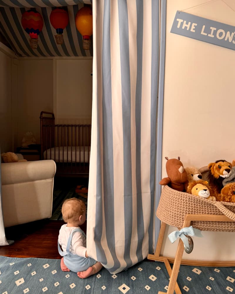 Baby playing on the floor of newly designed nursery.